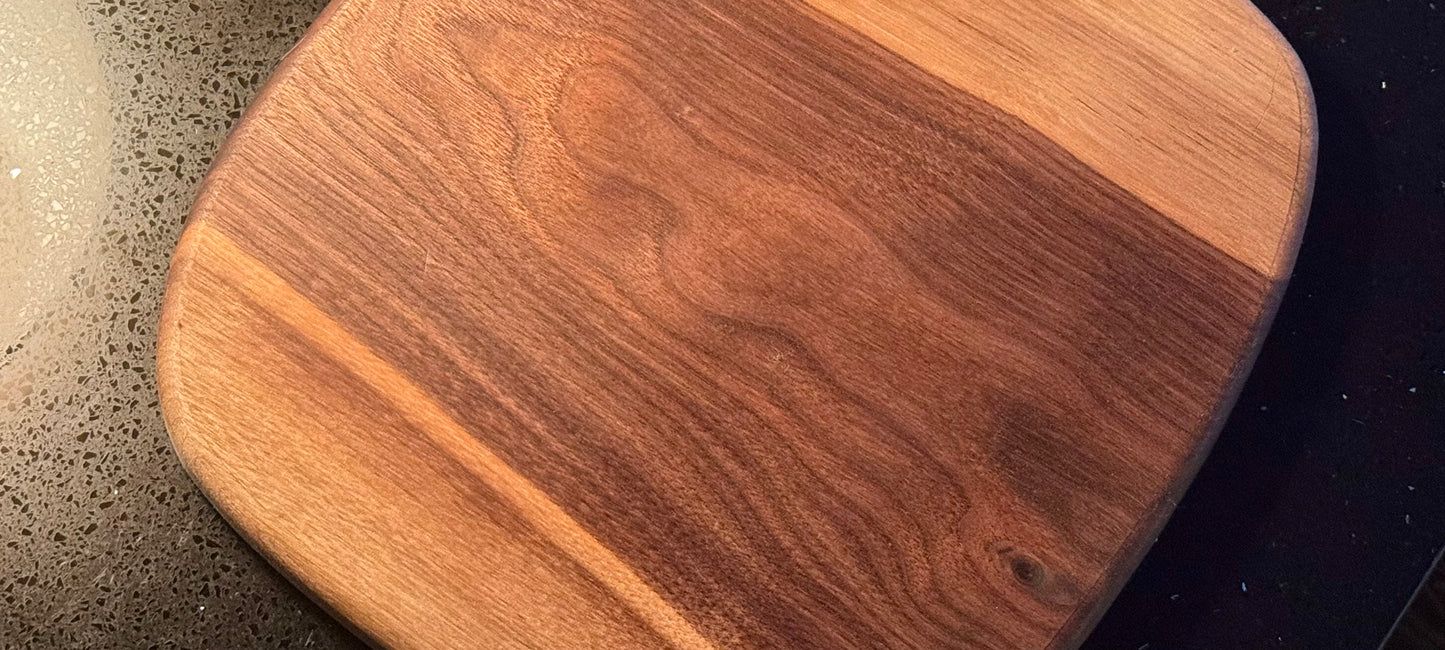 BLOSM | Cutting Boart 12”x 9” with a eggplant / squash handle. Walnut. Designed and Handcrafted in California. - BLOSM | Blossom Woodworking